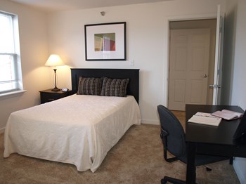 Marshall Park Townhome apartments in Richmond VA Bedroom 2 bedroom with desk and windows in Marshall Park Townhome apartments in Richmond VA - Photo Gallery 3