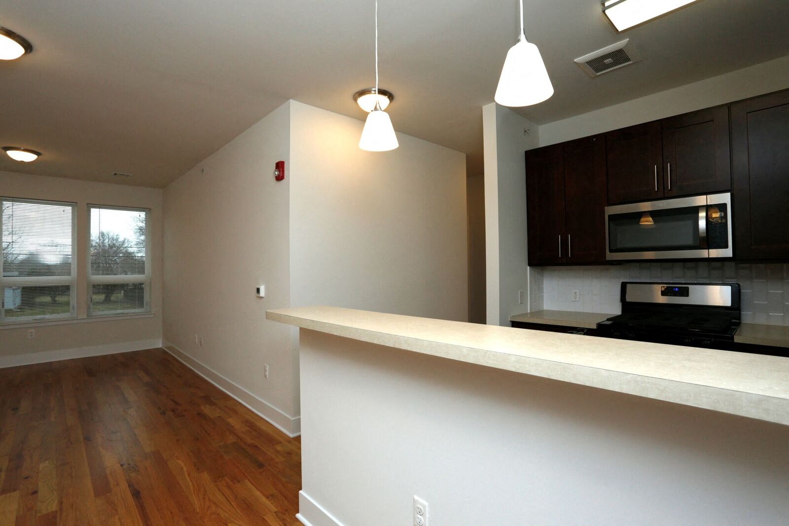 breakfast bar and kitchen with open layout view of living room