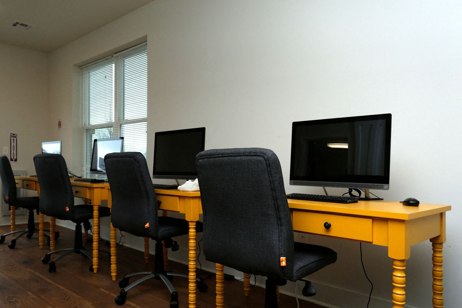 desks and computers in community rooms