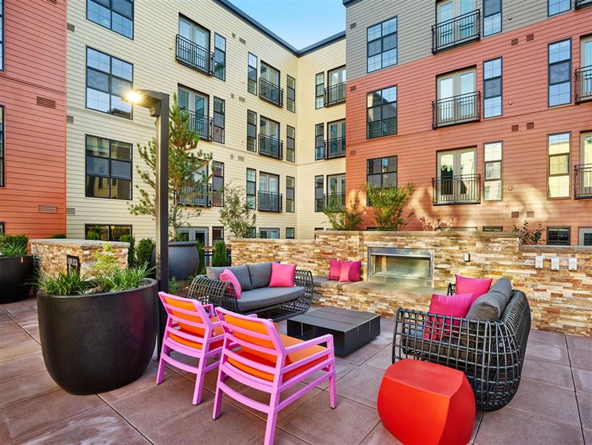 our apartments offer a patio with furniture and a fire pit