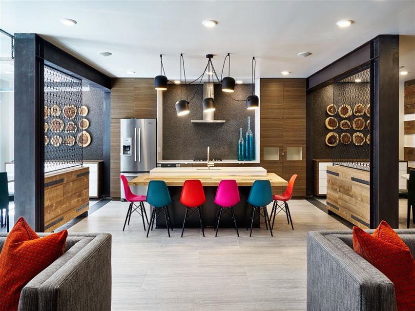 a dining room with a table and chairs and a kitchen
