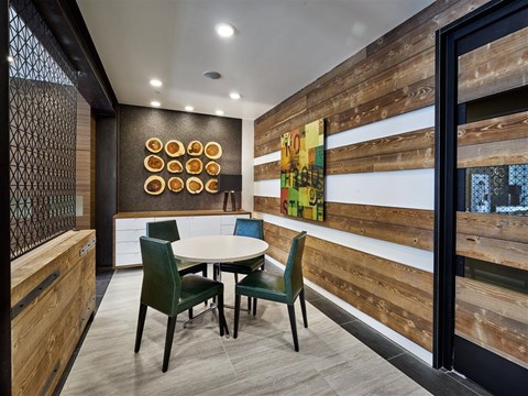 a dining room with a table and chairs