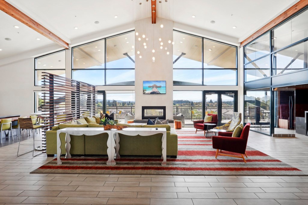 a large living room with a large table and a fireplace