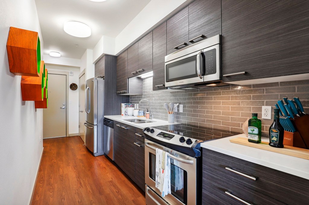 a kitchen with a stove and a microwave