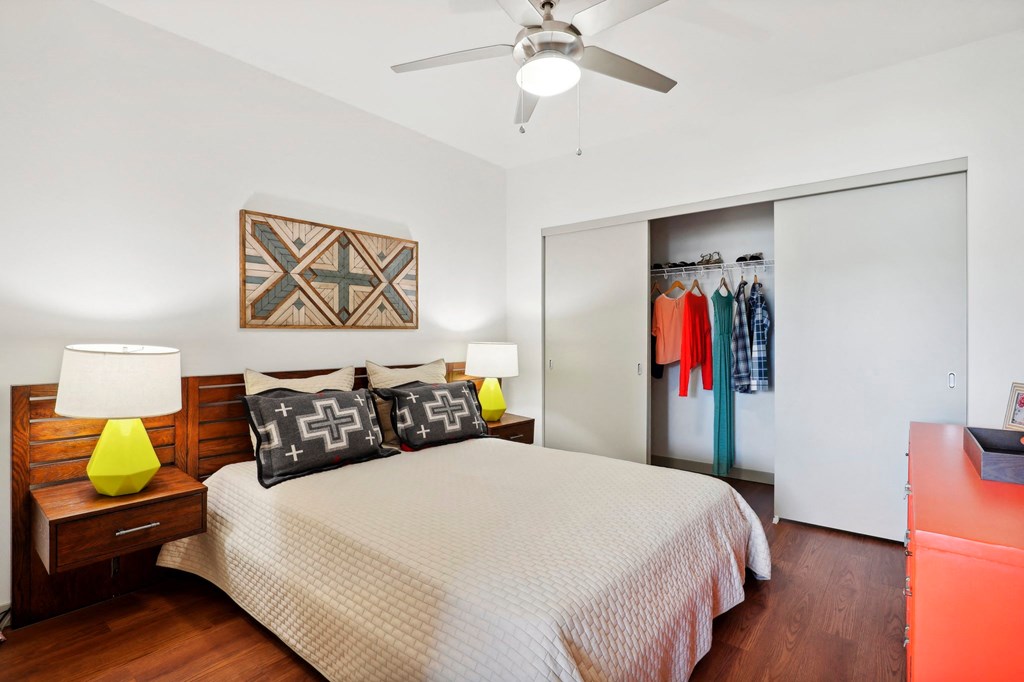 a bedroom with a large bed and a closet