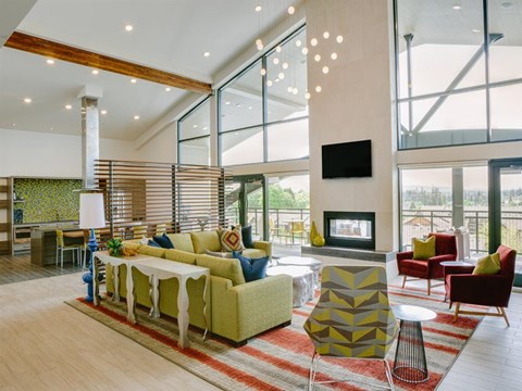 a living room with a couch and a table and a fireplace