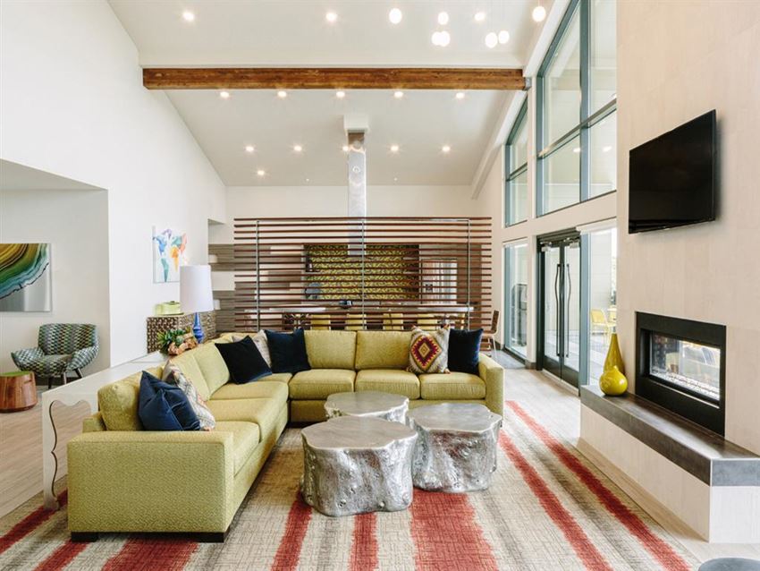 a living room filled with furniture and a fireplace