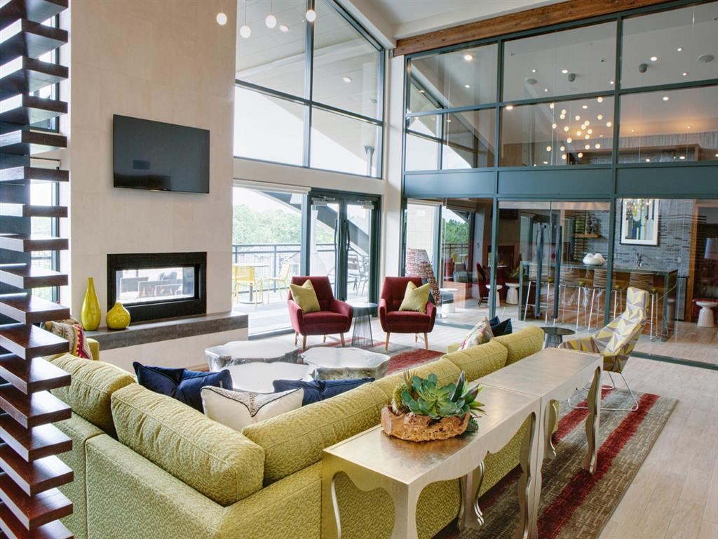 a living room filled with furniture and a fireplace