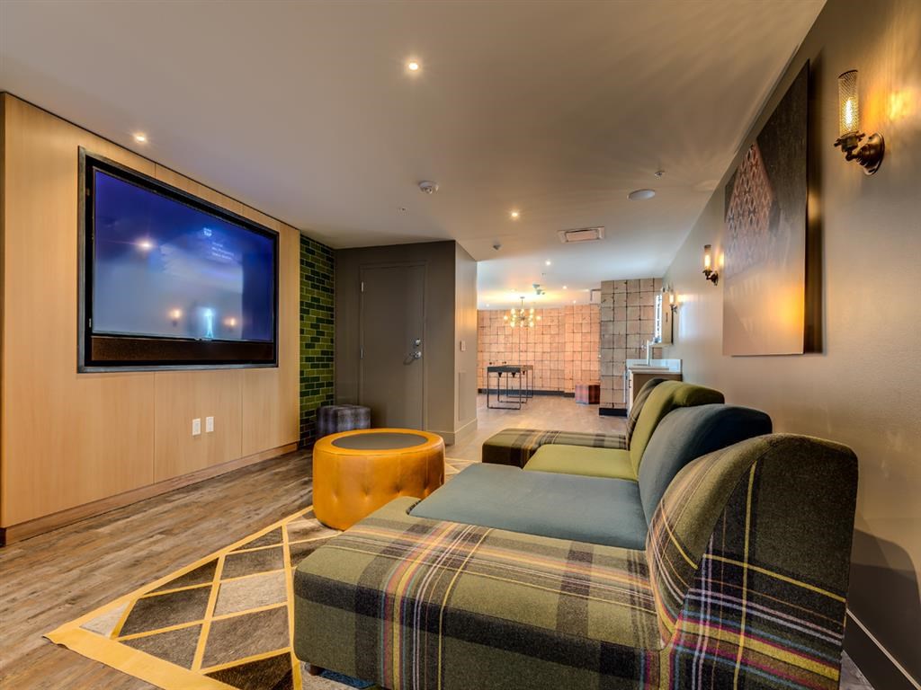 a living room with a couch and a tv