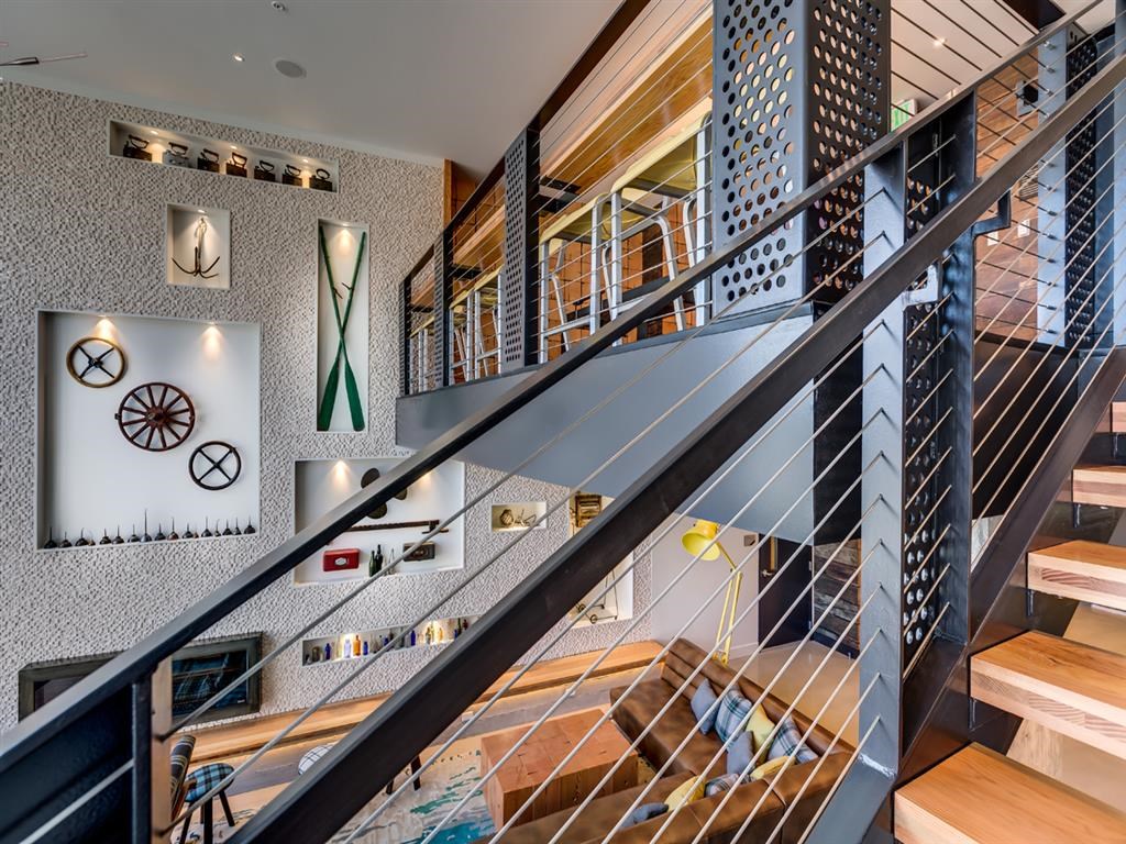 the lobby or reception area of a hotel with stairs