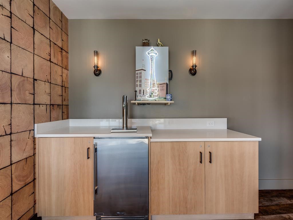 a kitchen with a sink and a refrigerator
