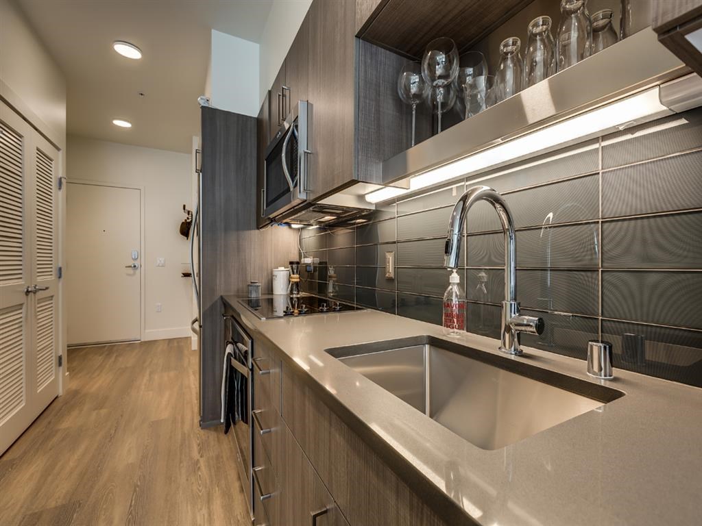a kitchen with a sink and a counter top