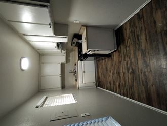 a small room with a projector on the wall and a door