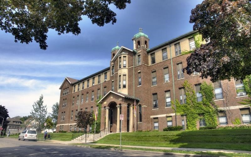 a large brick building on the side of a street