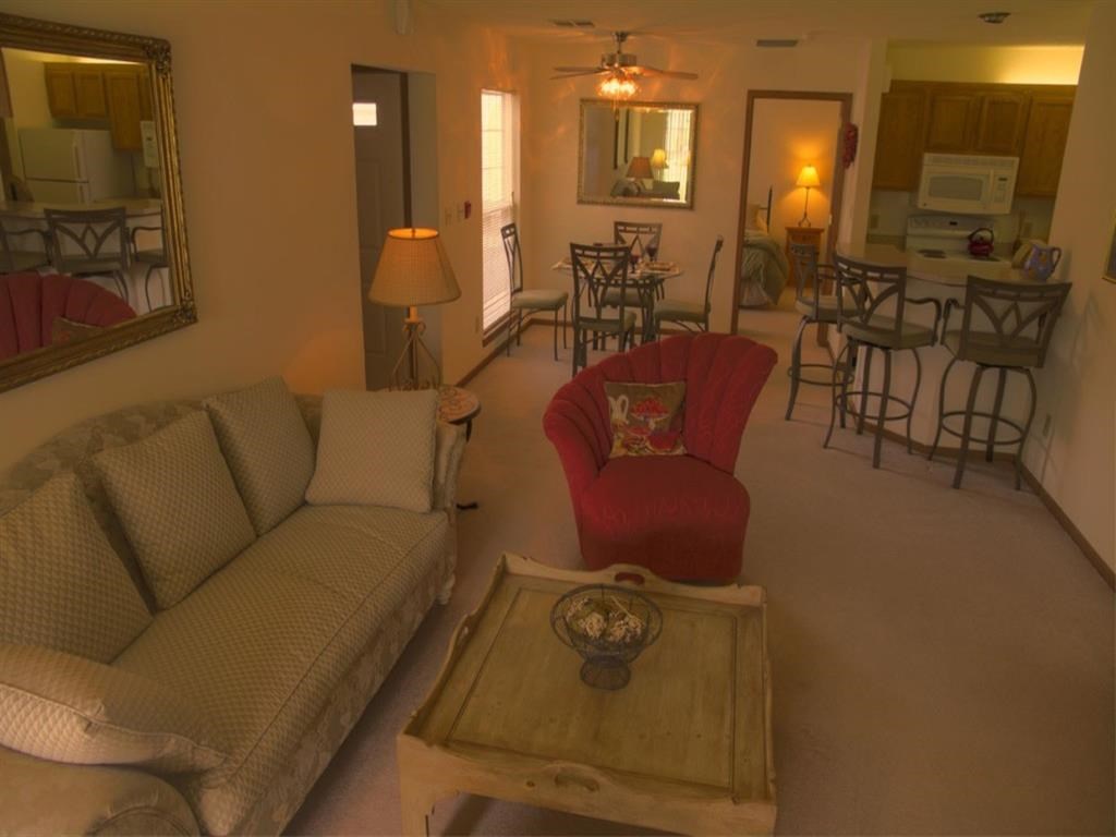 a living room with a couch and a chair
