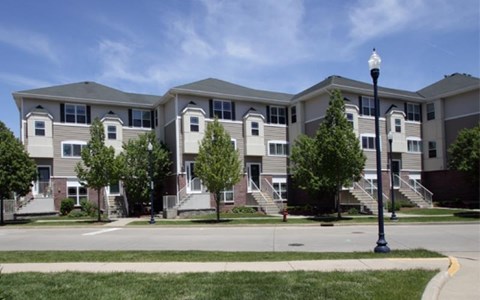 an apartment building on the corner of a street