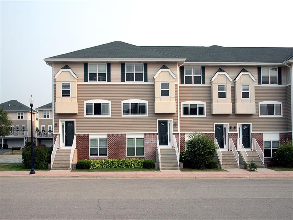 an apartment building on the side of a street