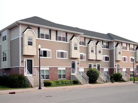an apartment building on the corner of a street