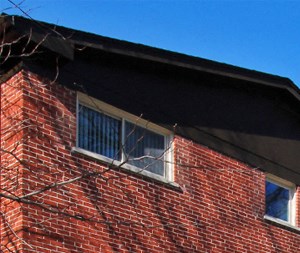 a brick building with a blue sky in the background