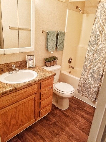 a bathroom with a sink toilet and a shower