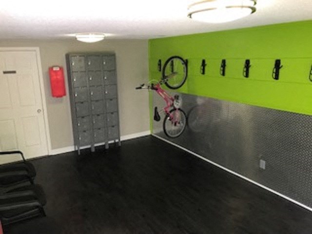 a bike is hanging on a wall in a room