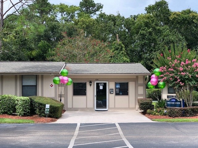 a building with balloons in front of it