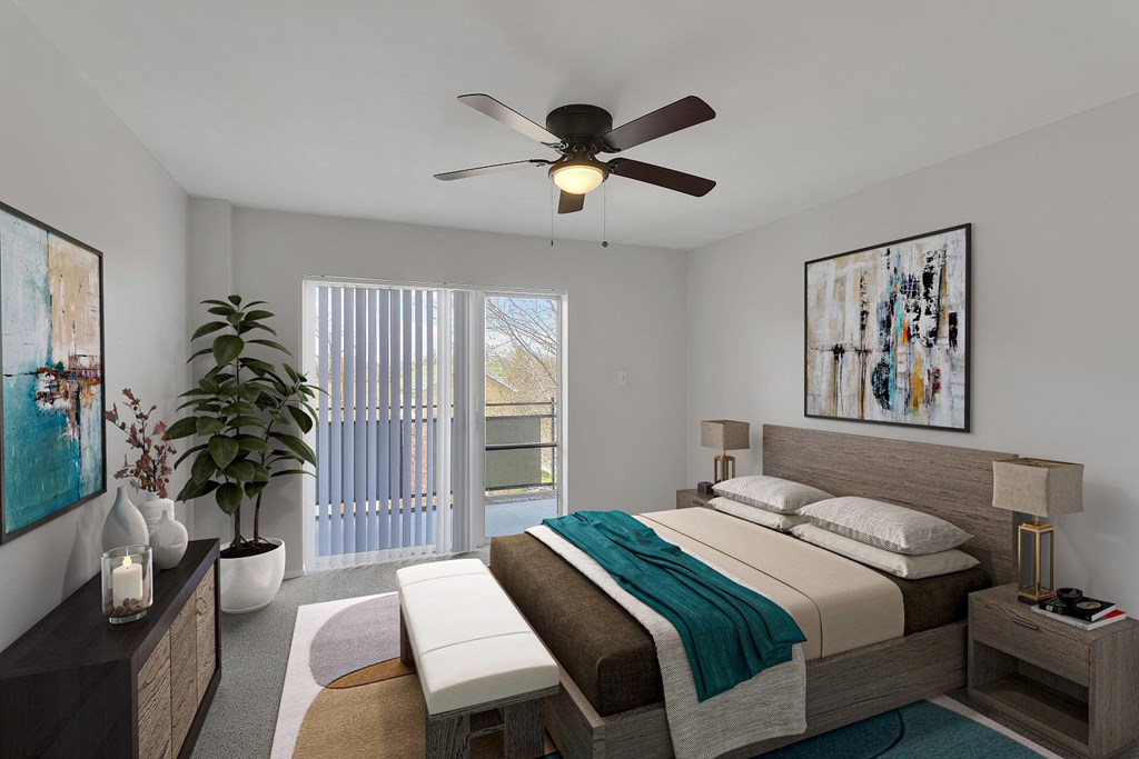 a bedroom with a bed and a ceiling fan