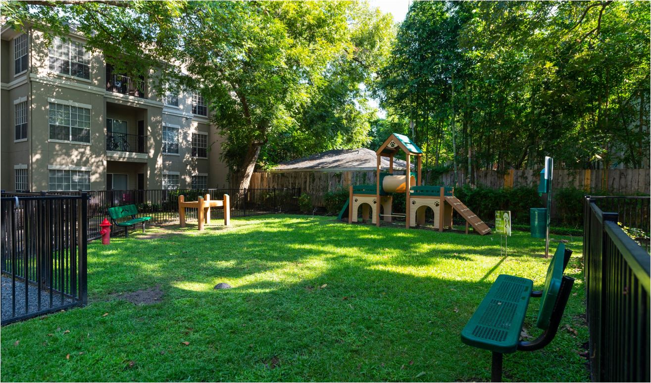 a backyard with a playground and a swing set