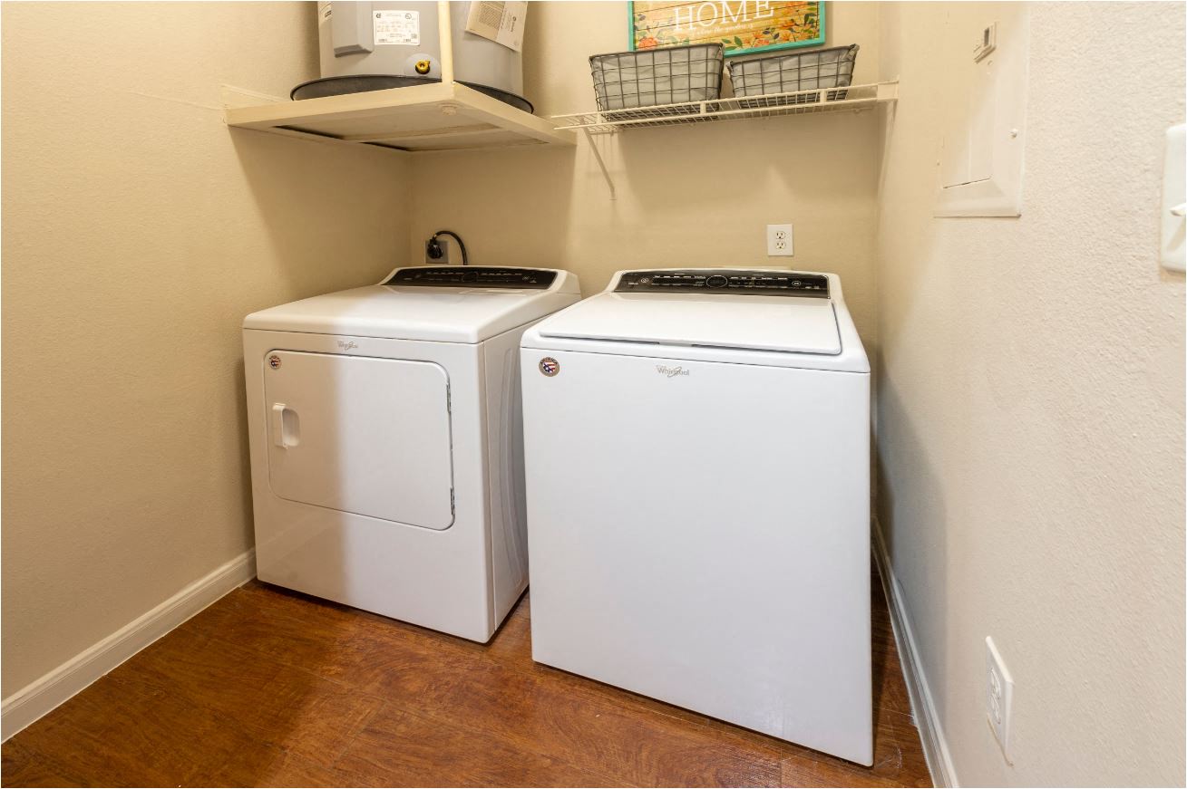 a washer and dryer are available in the laundry room of a home