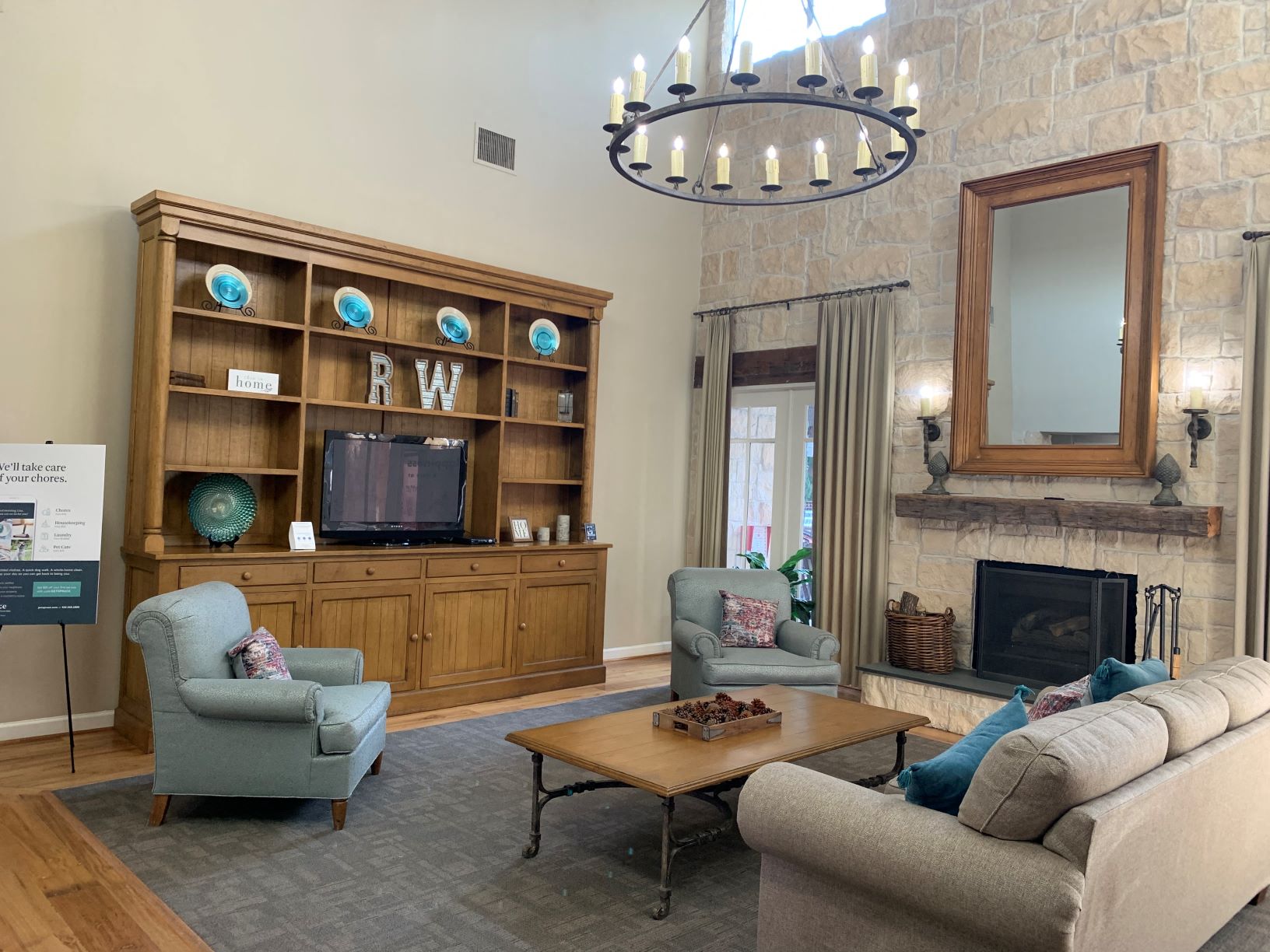 a living room with couches and chairs and a fireplace