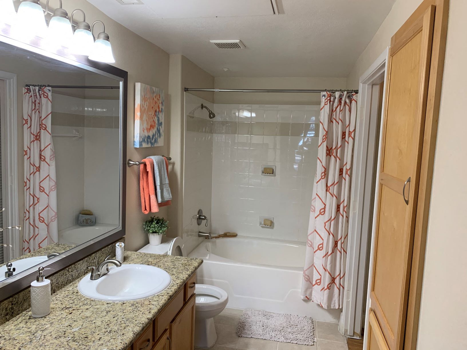 a bathroom with a sink and a shower and a toilet