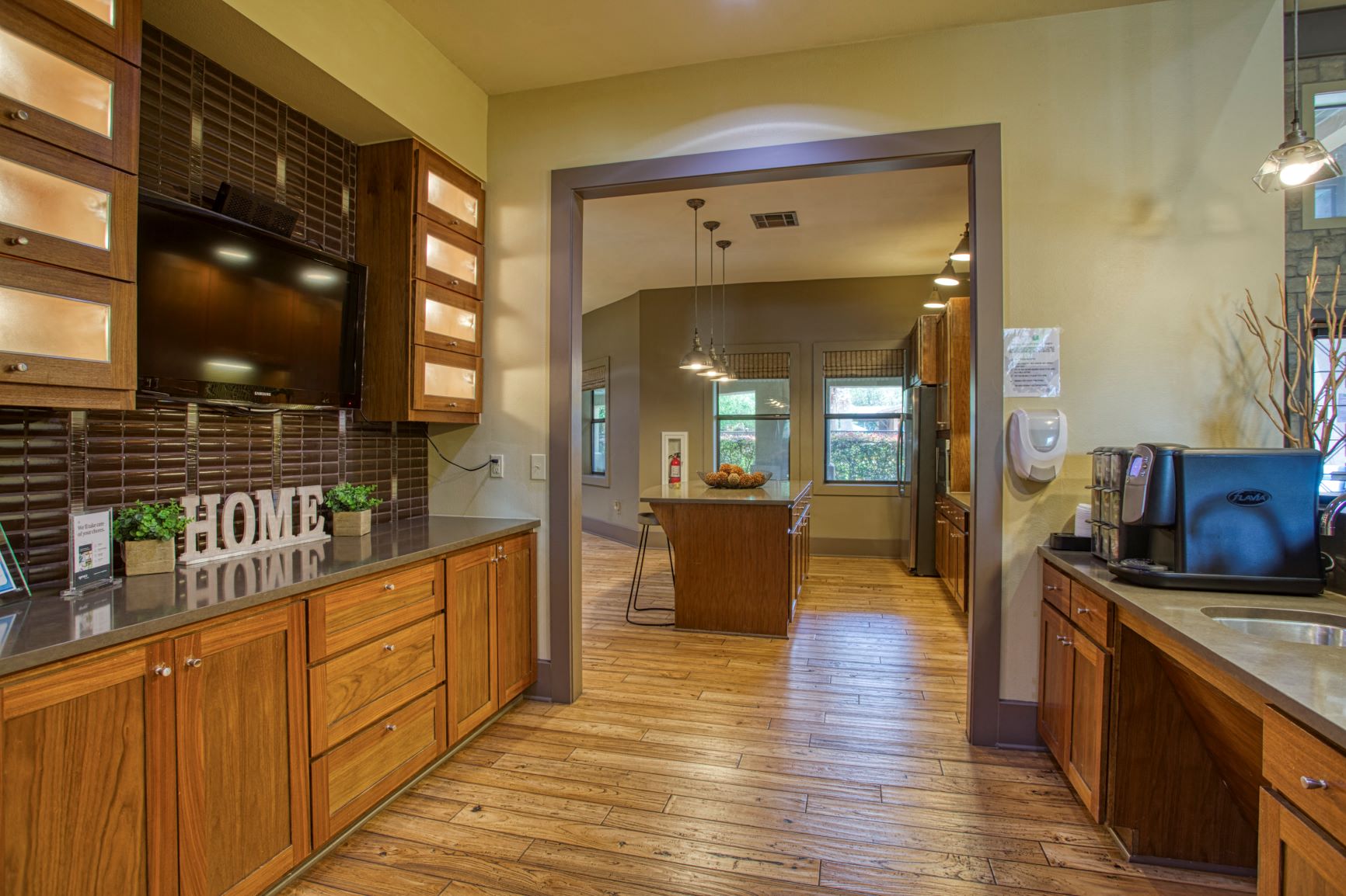 a kitchen with wooden cabinets and a counter top