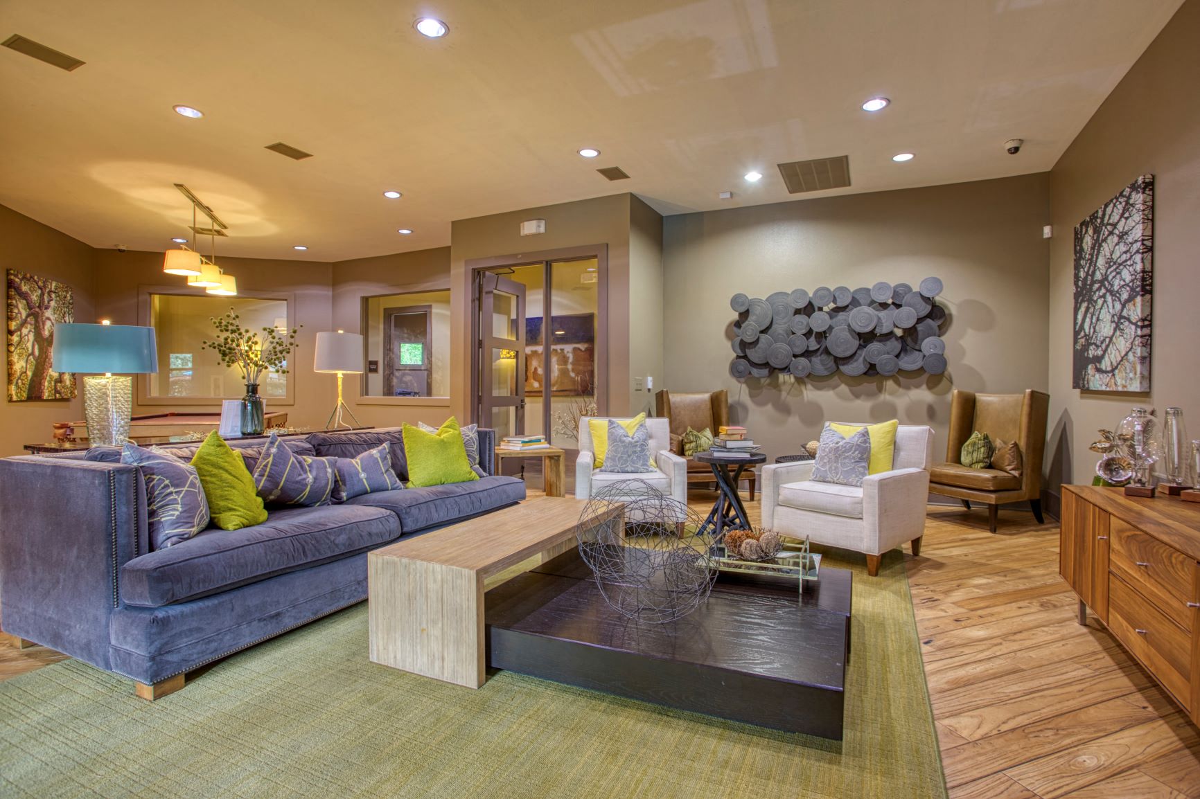 a living room with couches and chairs and a table