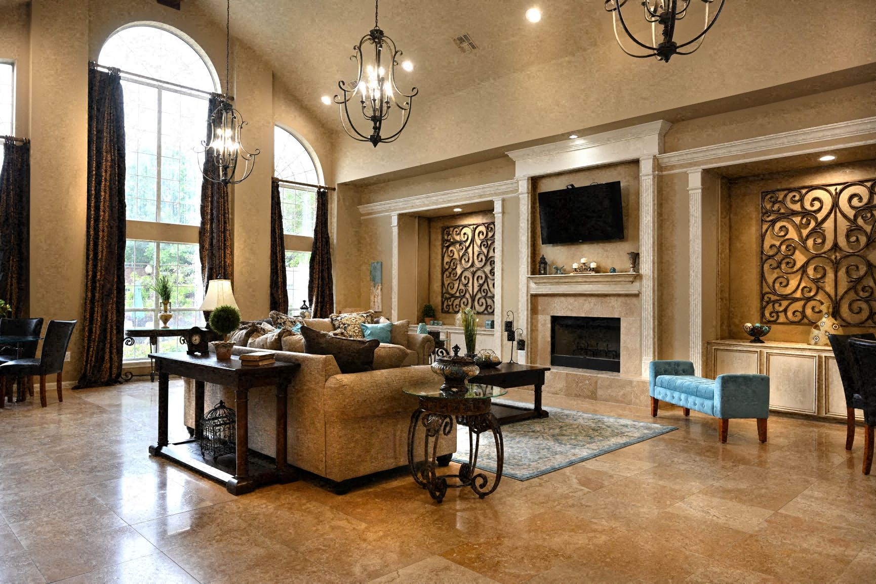 a large living room with a couch and a fireplace
