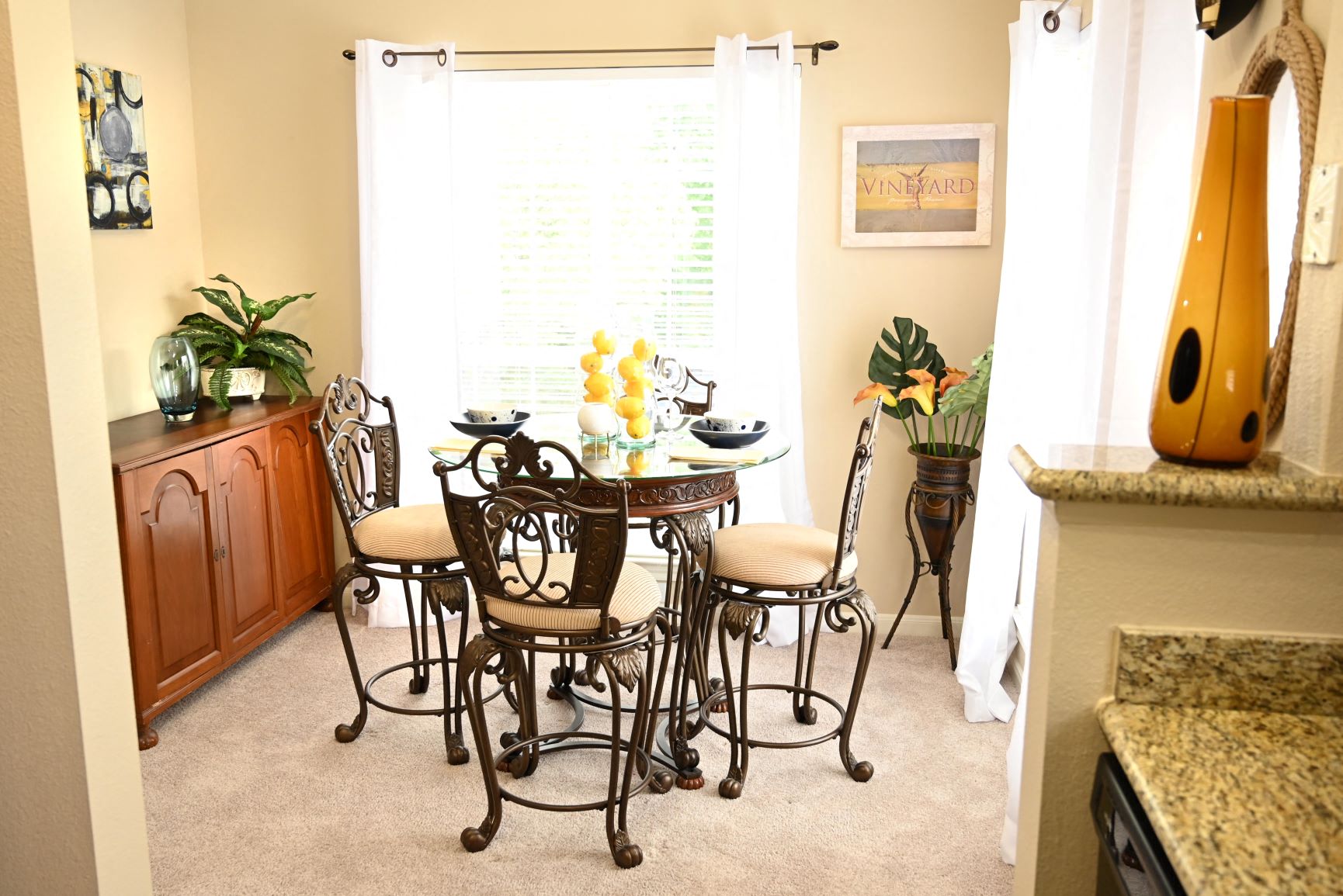 a dining room with a table and chairs