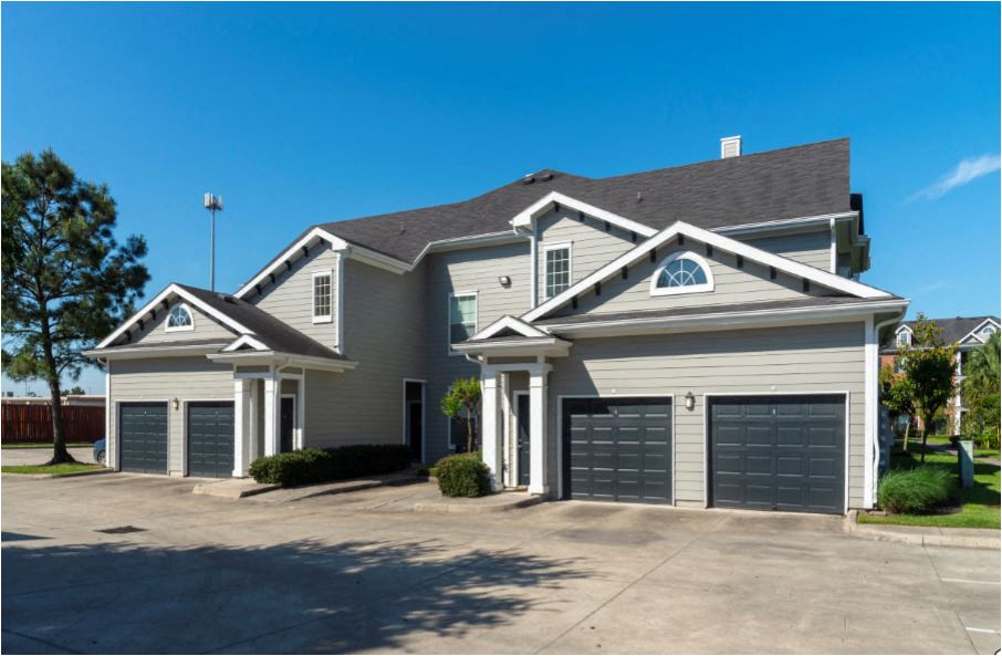 a large house with two garage doors