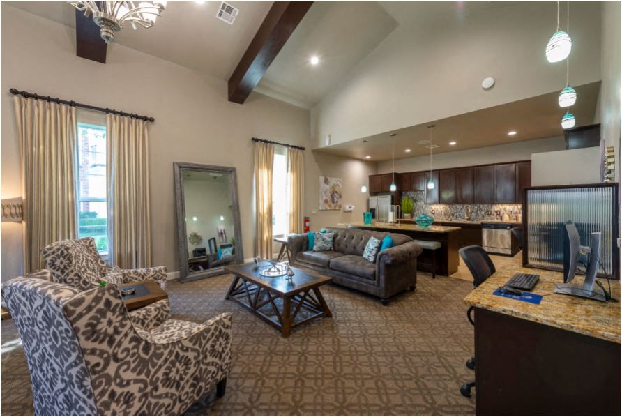 a living room with a couch and a table