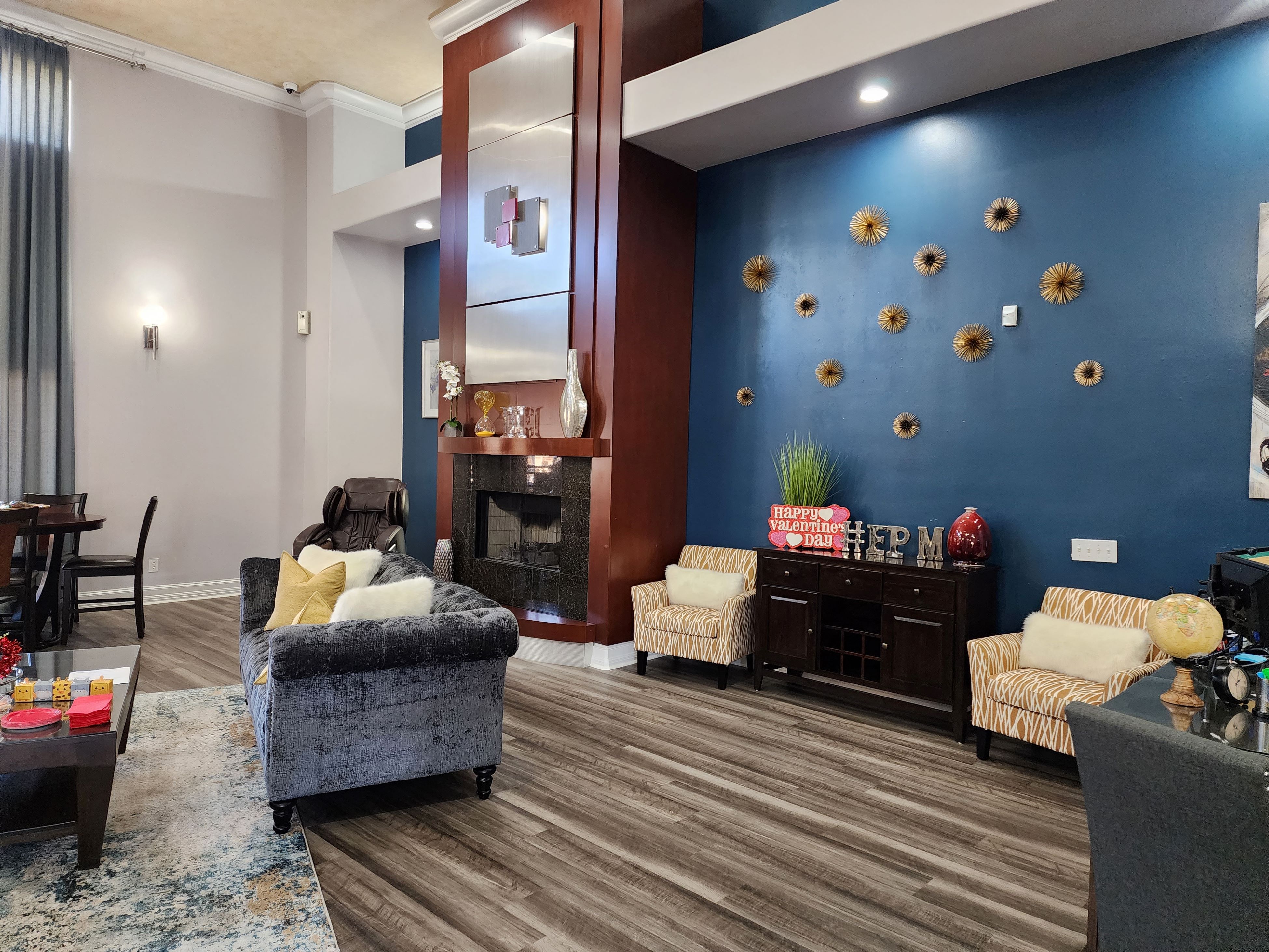 Apartments in West Houston, TX San Brisas Leasing office siting area with fireplace