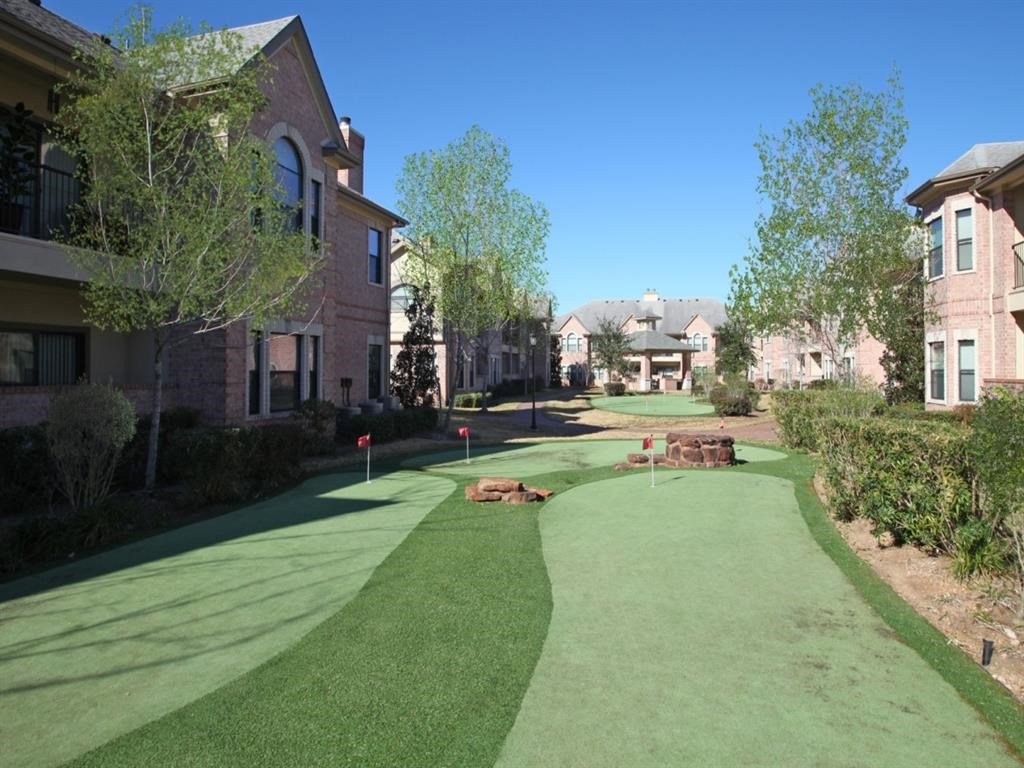 a golf course in the backyard of a house