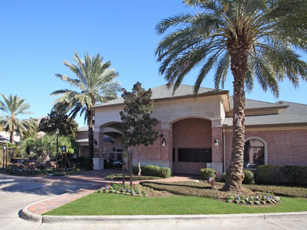 a building with palm trees in front of it