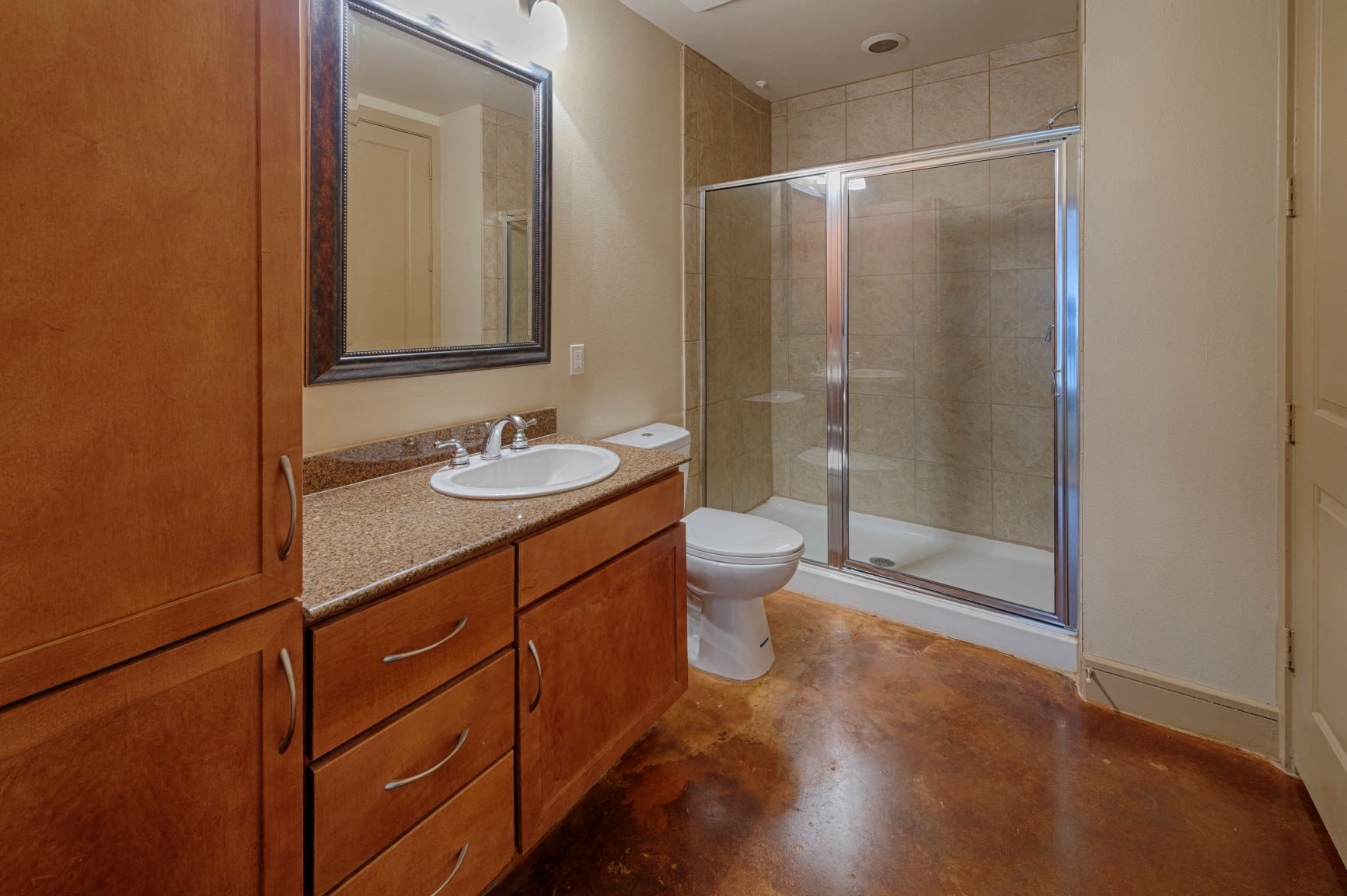 a bathroom with a sink toilet and shower