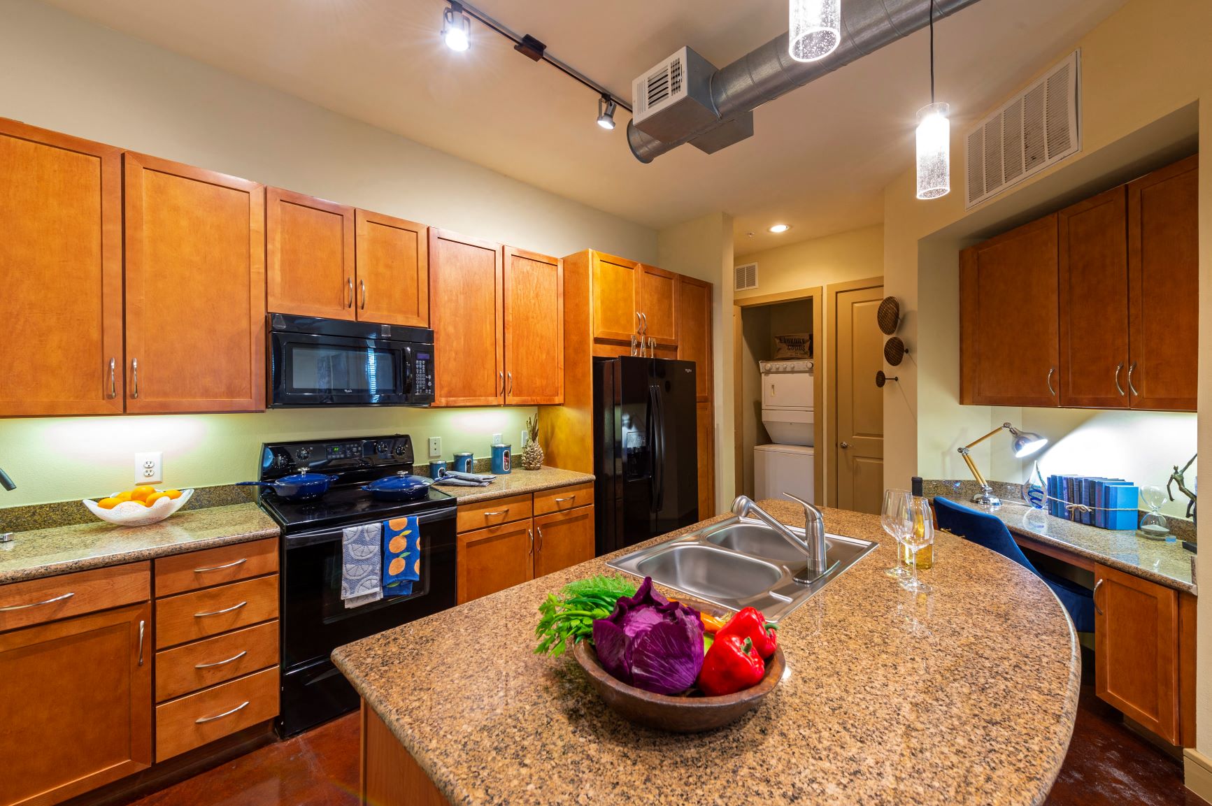 a kitchen with a granite counter top and a sink