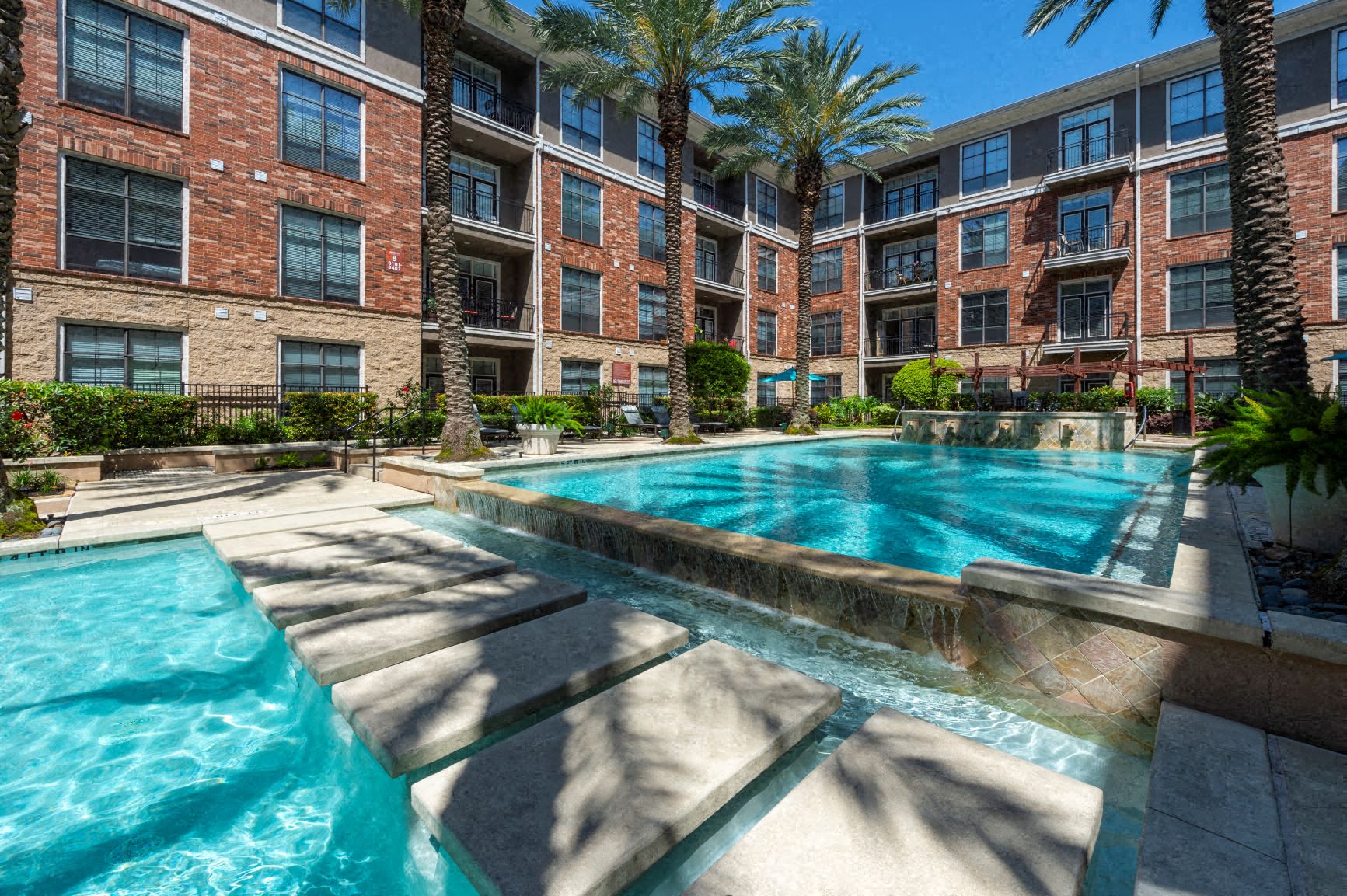 the swimming pool at the trilogy apartments in palm springs