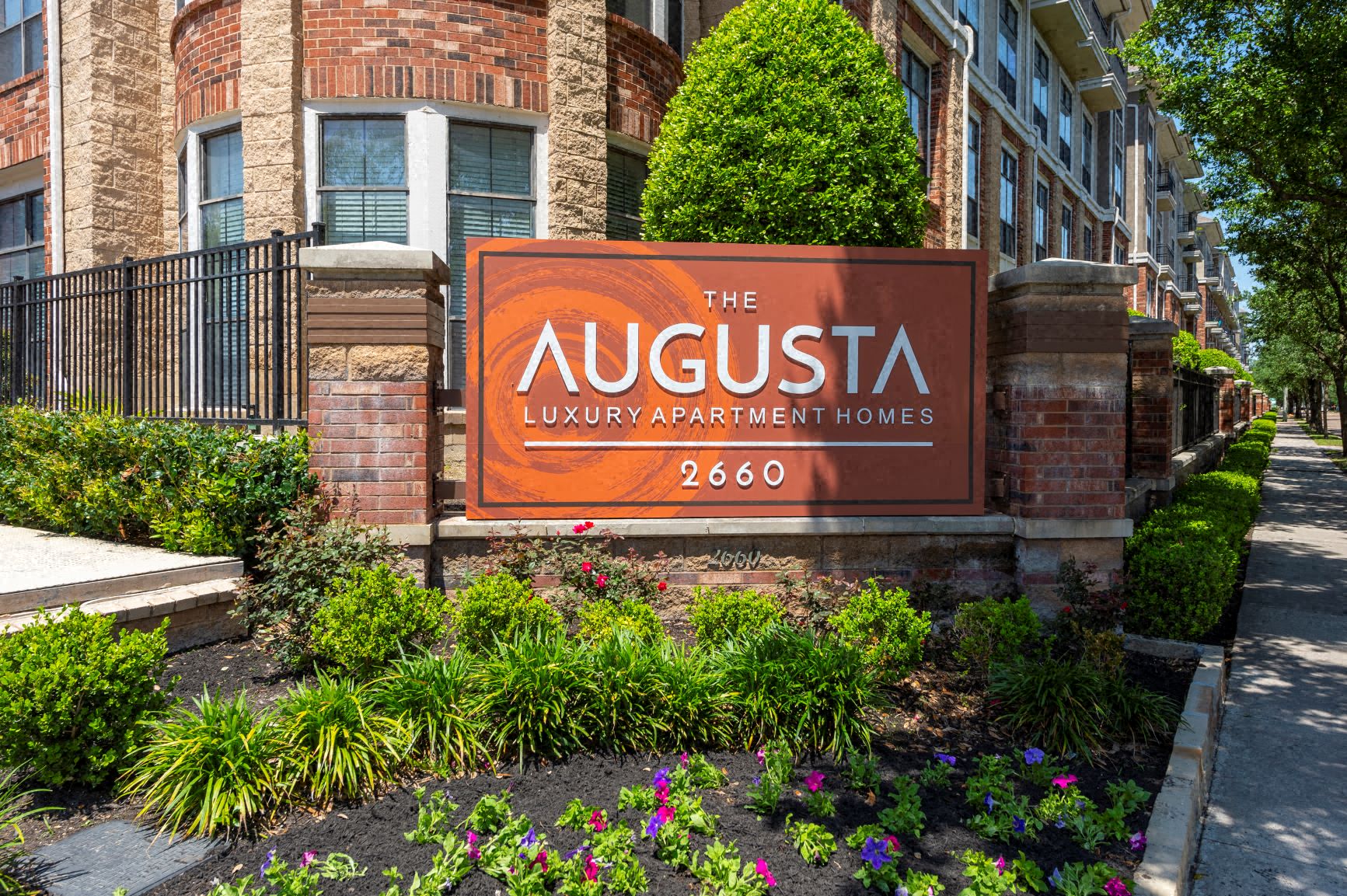 the luxury apartment homes sign in front of a building