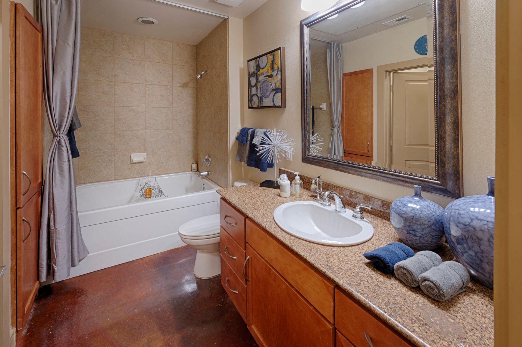 a bathroom with a sink toilet and a bath tub