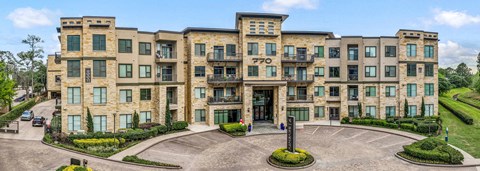 A large, multi-story building with the number 770 on the front.