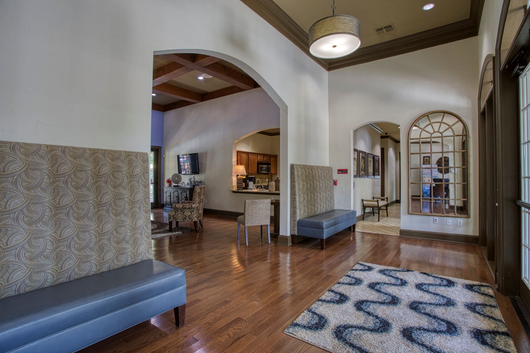 a living room with a couch and a rug