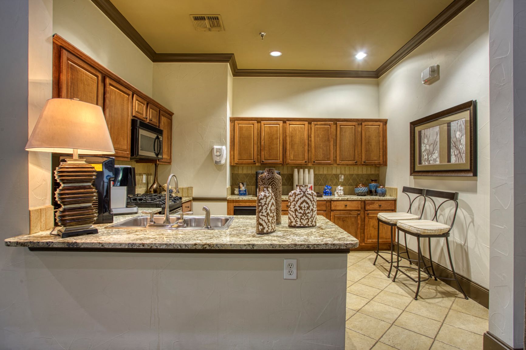 a kitchen with a counter top and a sink