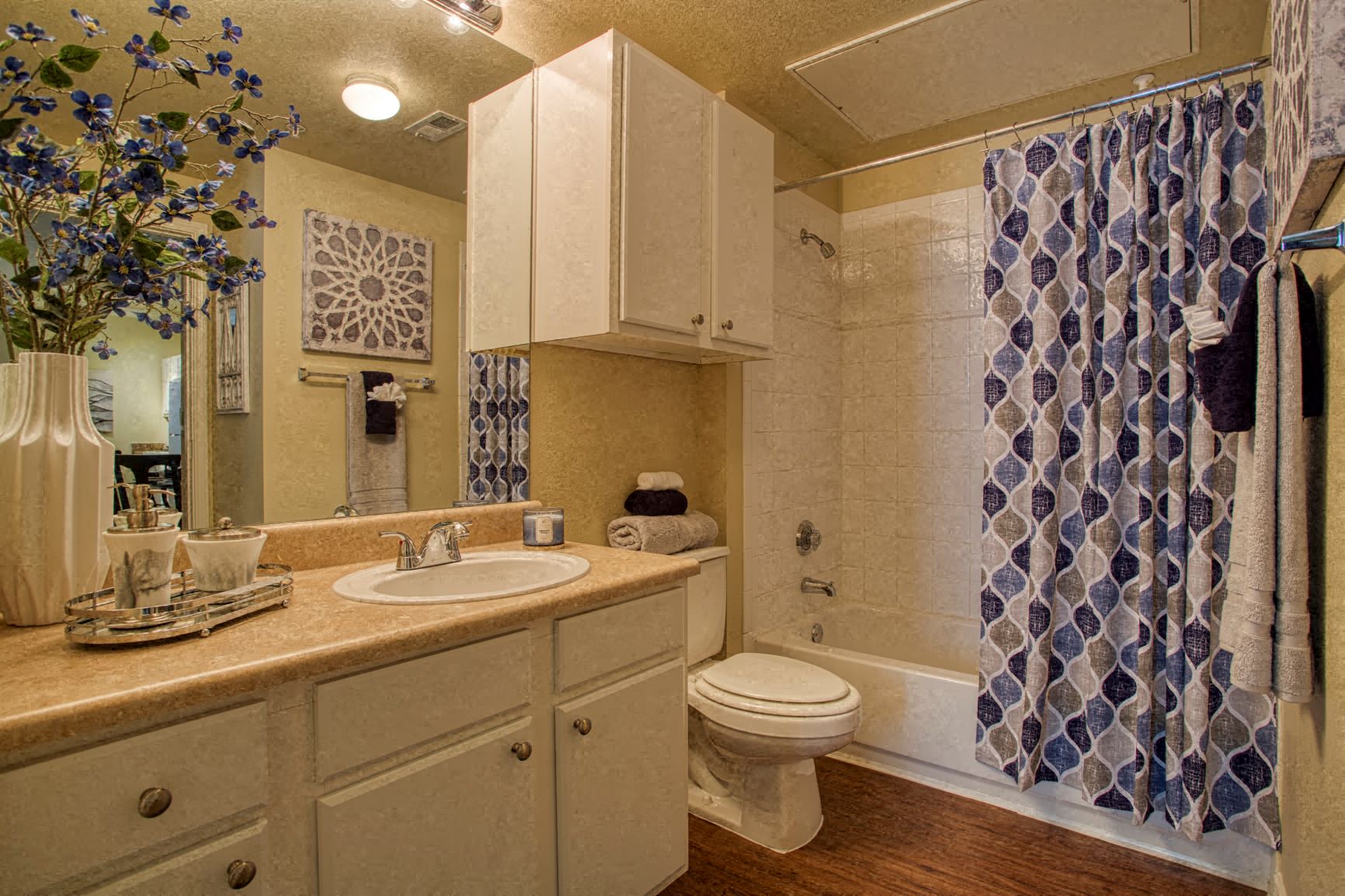 a bathroom with a sink toilet and shower