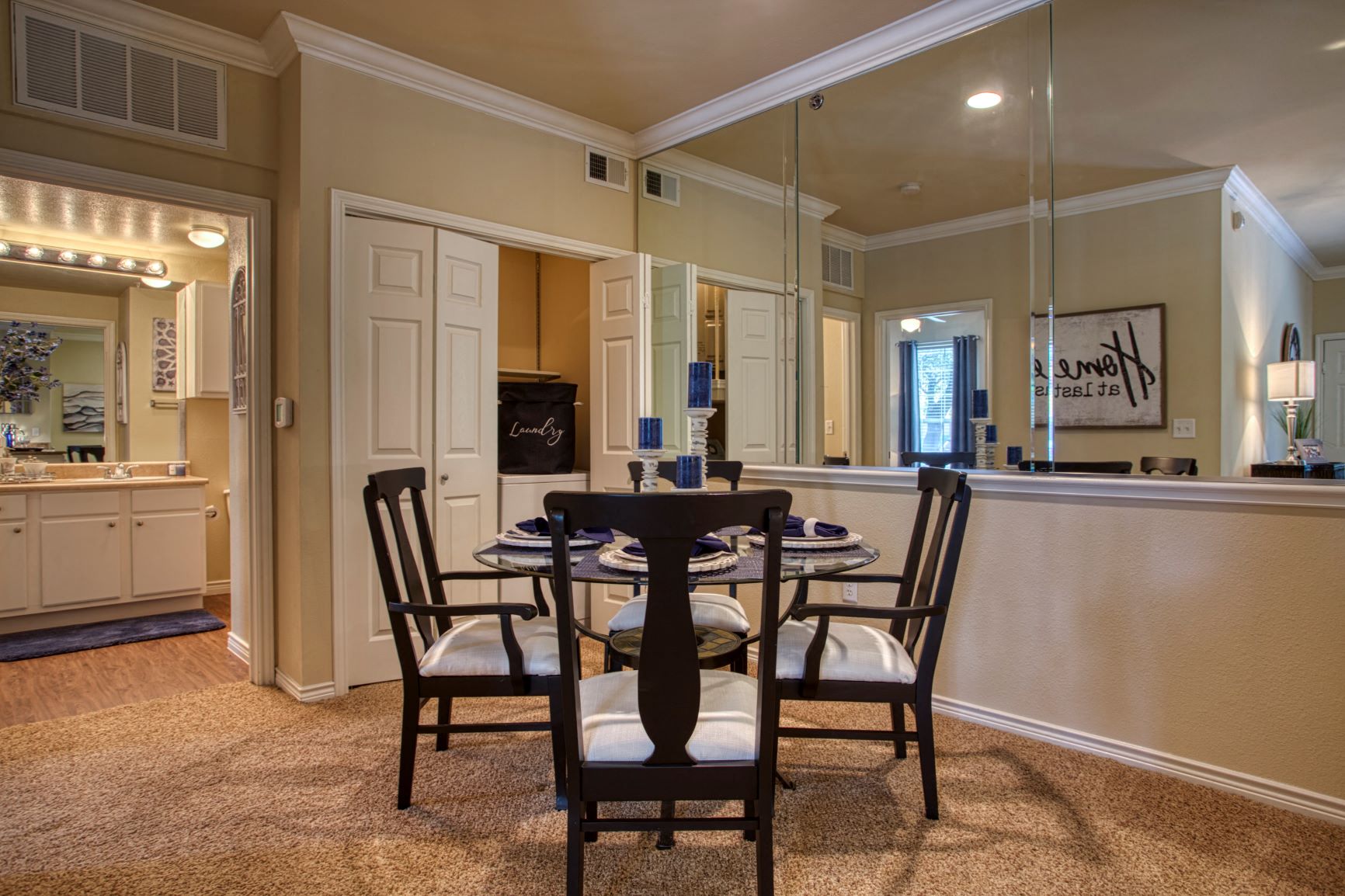 a dining room with a table and chairs